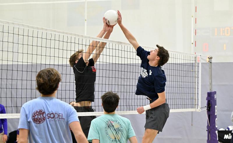 Cape’s Lawson Whaley, right, and Delmarva Christian’s Harrison Schlabach battle at the net during a scrimmage. DAN COOK PHOTOS