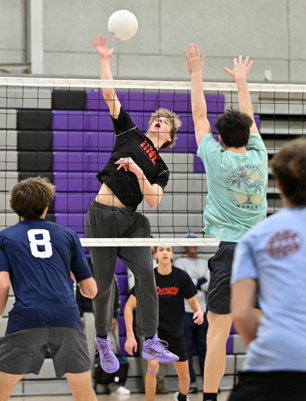 Royals senior Harrison Schlabach slams a kill.
