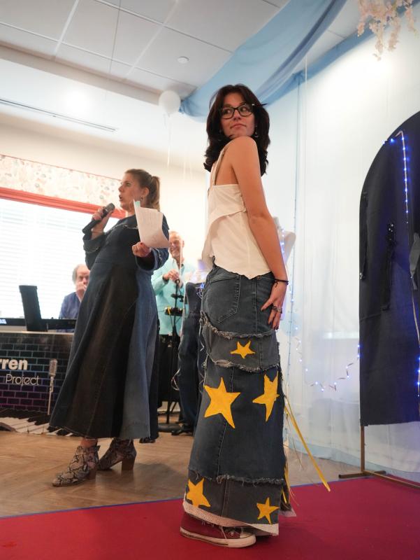 Taylor Ruark, a junior, shows off the maxi denim skirt she designed. She also designed her white blouse.