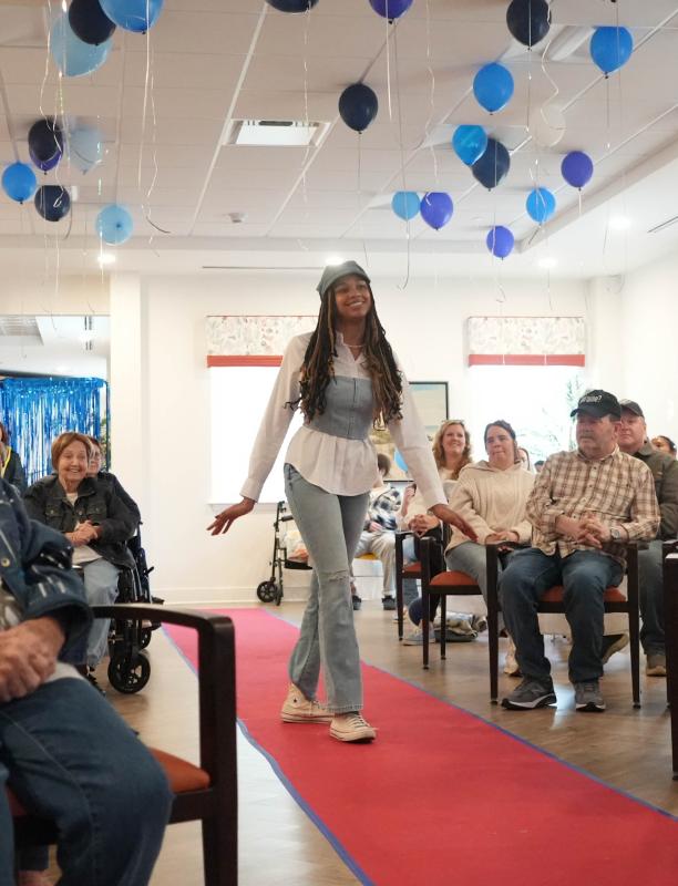 Cape fashion student Illiana Colon, a senior, models a denim corset and hat designed by classmates Saniyah Greene and Naisae Ngido, respectively.