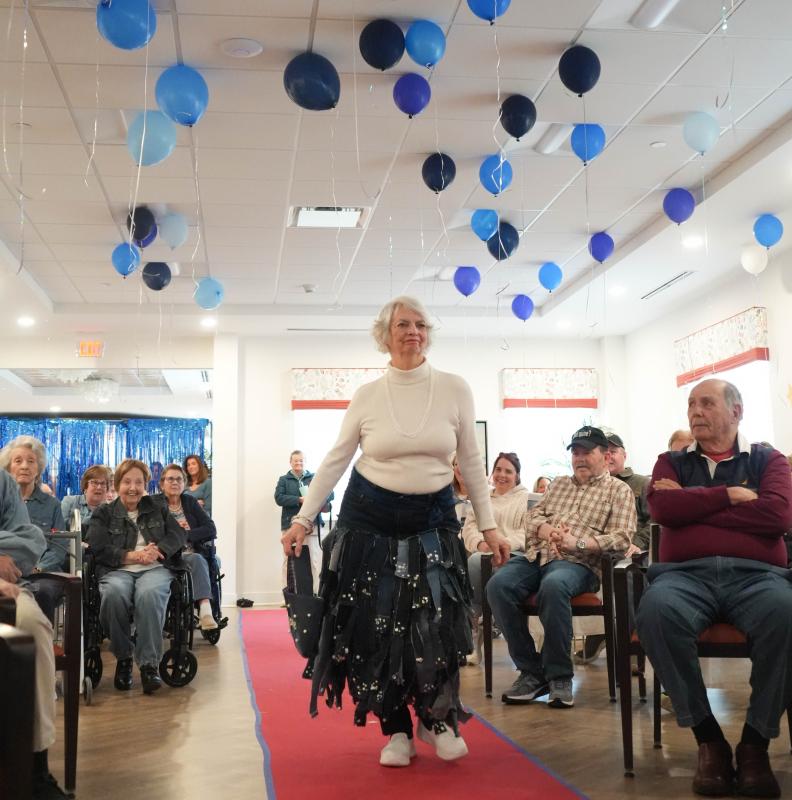 June Walters models a denim purse and a skirt adorned with denim strips. The skirt was designed by Cape student Milena Buehler, and the purse by Alexa Ayella.