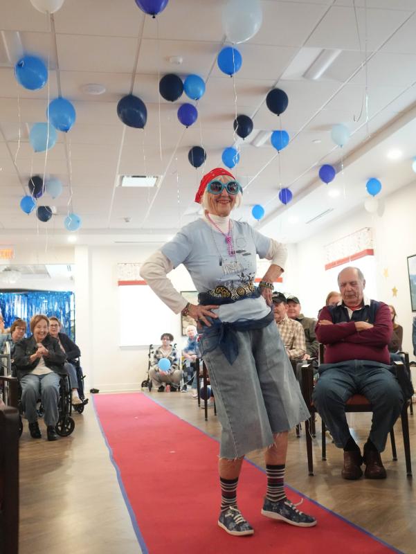 Ellie Hoffman, a resident at the Lodge, strikes a pose as she models shorts designed by Cape student Emma Brennan.