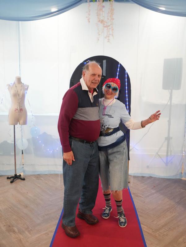 Ellie Hoffman, right, who modeled in the fashion show, stands with her husband Tom after the show.