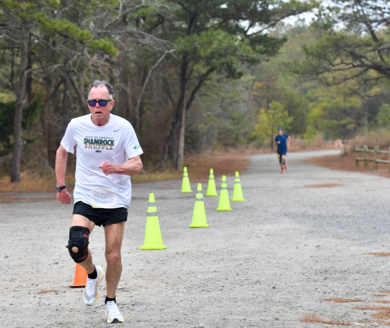 Richard Boyle, 73, completes the 5K course in 21:18.