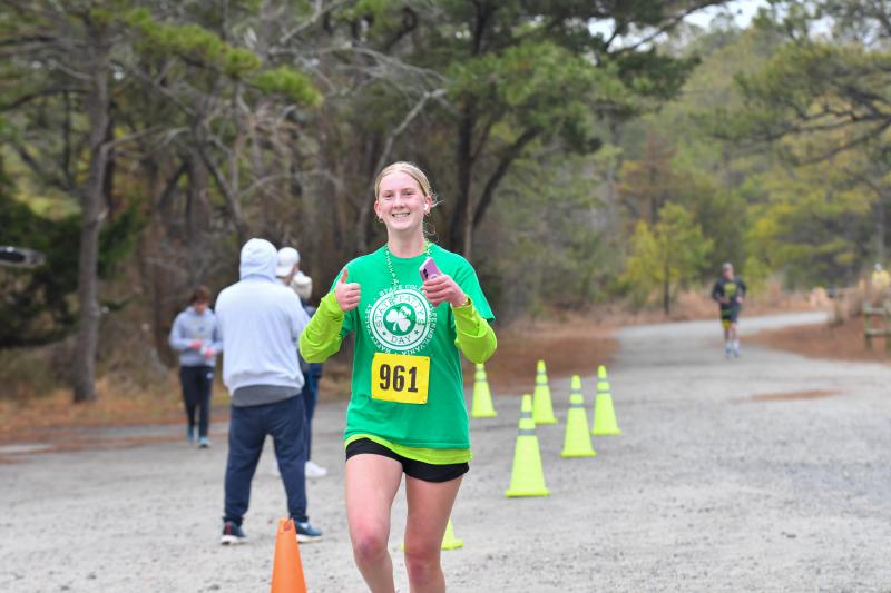 Ellen Ramsey crosses the finish line in 31:31.