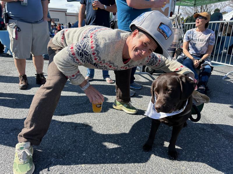 Dogfish Head founder Sam Calagione celebrates 302 Day with his dog, Maple.