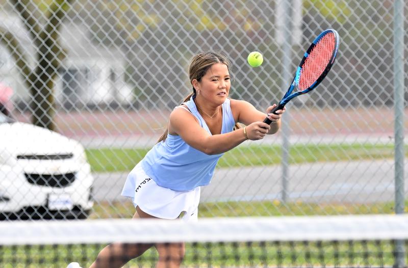 Cape’s Anika Sekhri pops a backhand volley at second doubles.