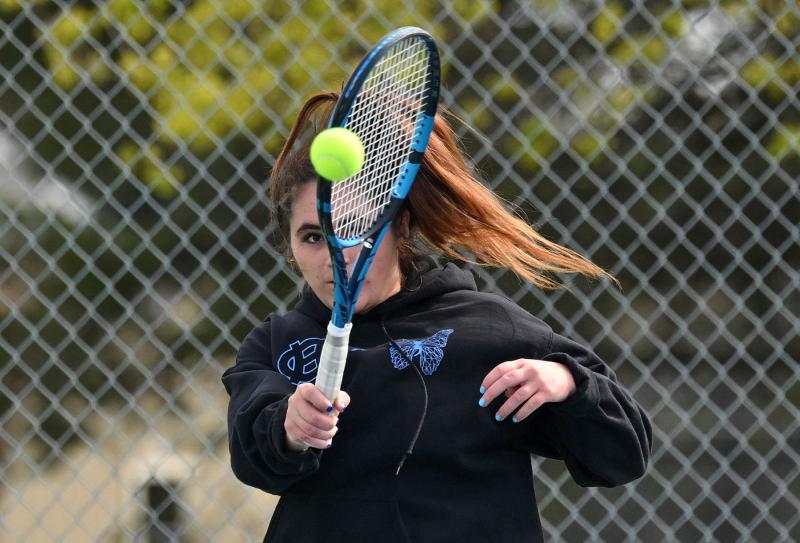 Cape first-doubles player Mya DiSabatino hits a forehand in the loss to Caesar Rodney. DAN COOK PHOTOS