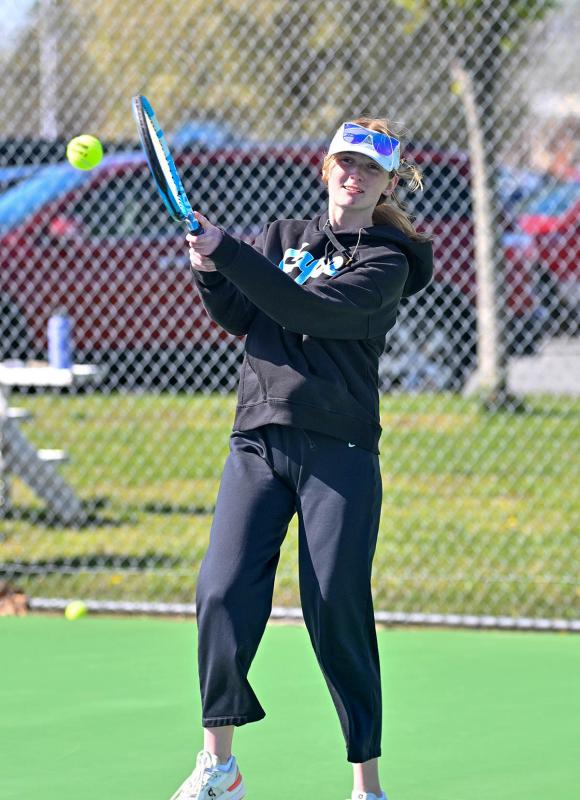Kathryn Costello hits a backhand drive in her second singles victory.