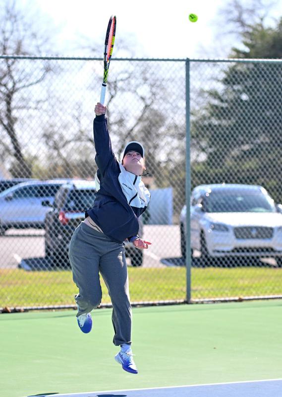 Sussex Academy first singles Karina Lopez hits a serve in her loss to Vikings player Abby Hazzard.