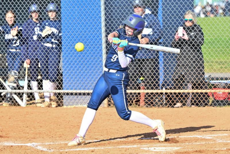 Sussex Academy eighth-grader Ashlyn Troxler slams a ball into the outfield.
