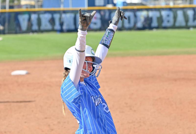 Cape senior Bri Windish celebrates her triple at third.