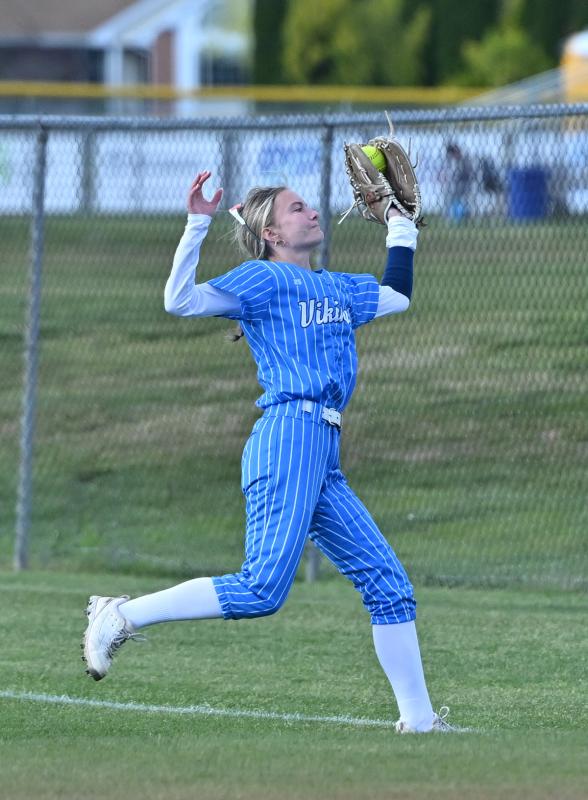 Cape senior right fielder Abbi Crouch snags a fly ball in foul territory.