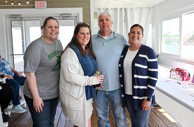 Shown helping out with the bash are (l-r) Maryellen Kiernan, Kathy and Mike Newcomb, and Dana Smith.