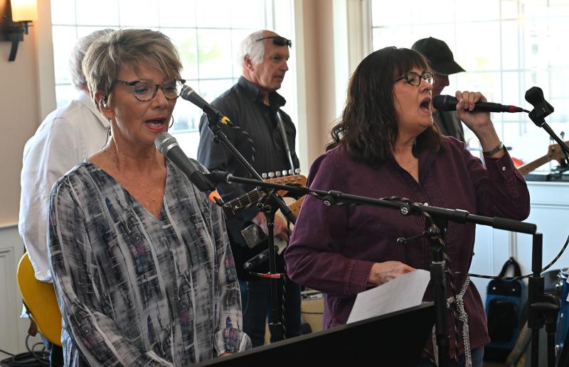 Donna Ward, left, Linda Beebe sing with the group 33 1/3.