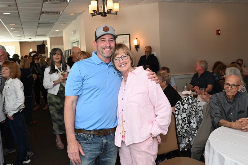 CCF board member Tommy Engel gets a hug from friend Chris King.