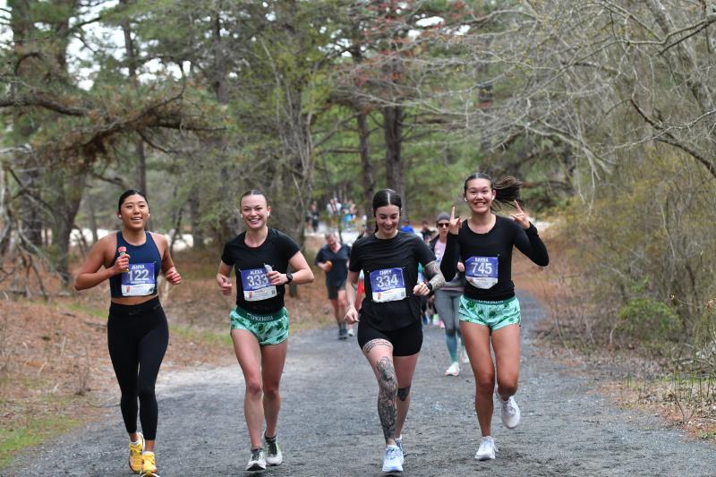 Marathoners running happy at six miles.