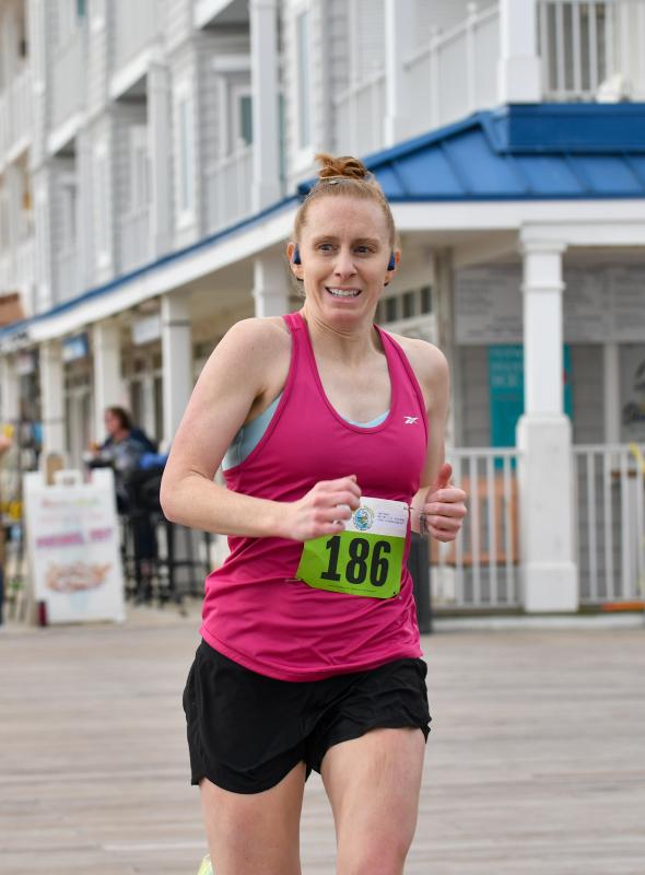 Ryann Hall from Downingtown, Pa., is the first woman finisher, with a time of 18:58.