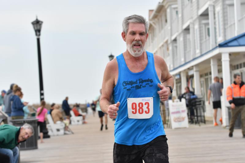 Chris Stanley, 56, runs 22:25 for second place in the male 55-59 age group.
