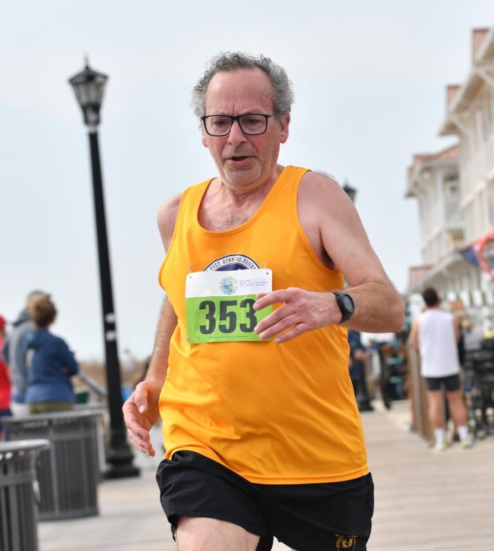 Sam Piazza, 63, runs 24:58 to win the male 60-64 age group.