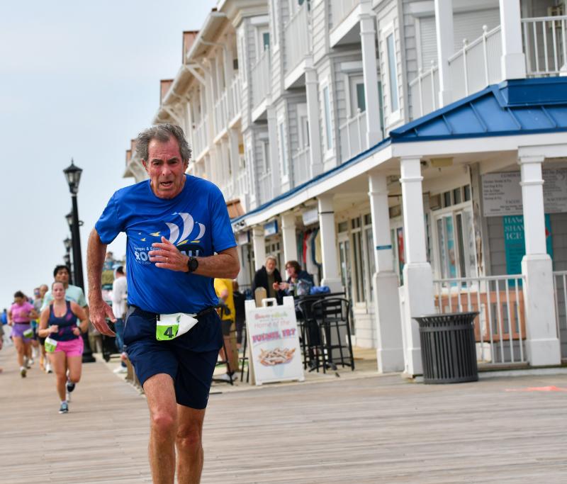 David Travis, 69, wins his age group in 25:48.