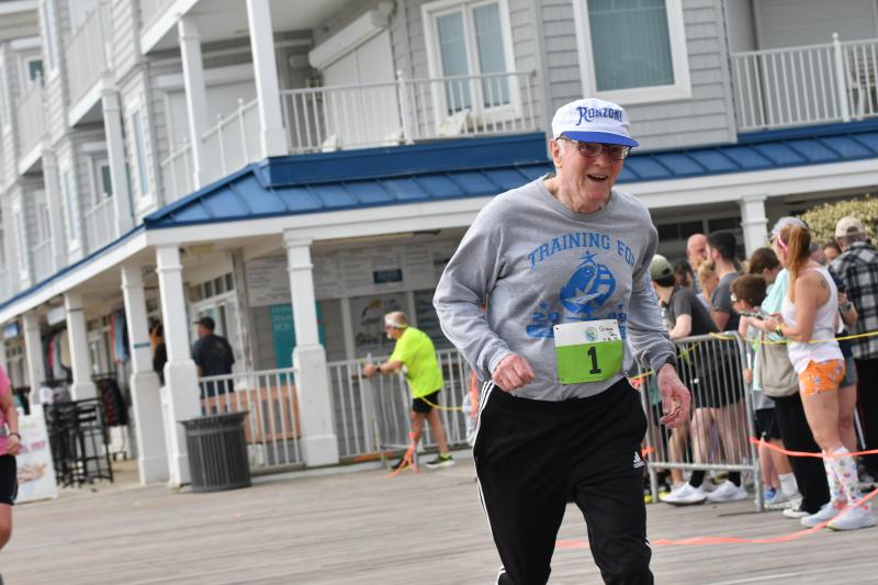 John Gilsenan, 82, gets bib No. 1 and runs 43:01.