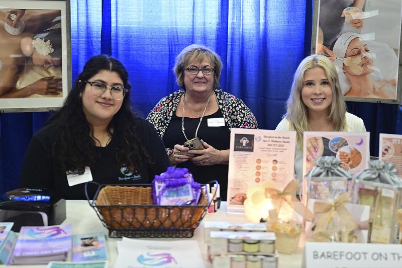 Shirley Class, center, owner of Barefoot on the Beach, is surrounded by Jamelet Class, left, and Maddy Class.
