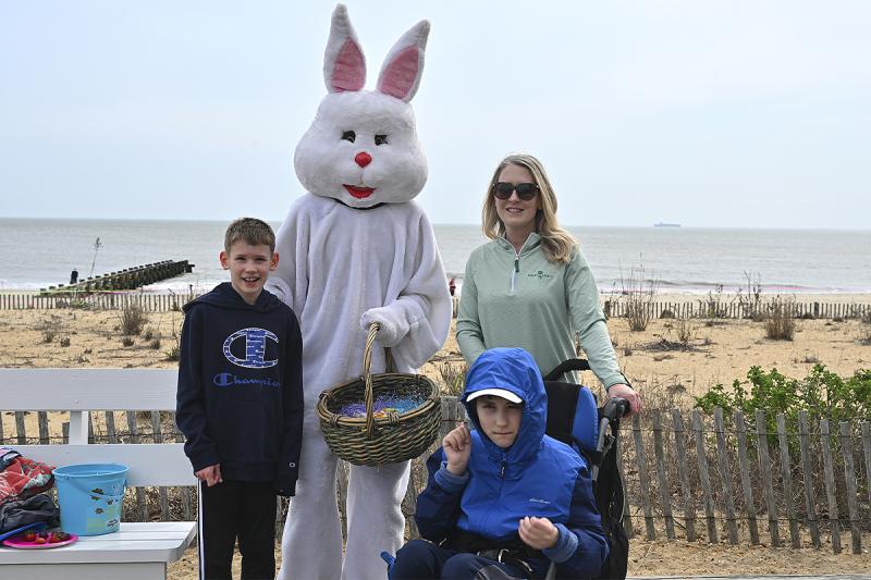Pausing for a photo with the Easter Bunny are (l-r) Hudson Boyle, Jamie Boyle and Aiden Boyle in front.
