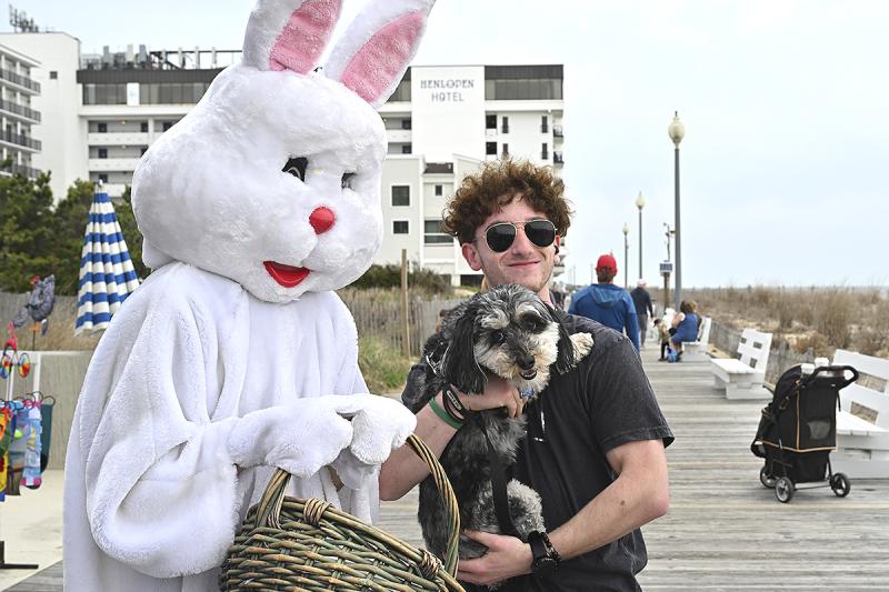 The Easter Bunny takes time to get a photo with Bradley Hart and Buddy.