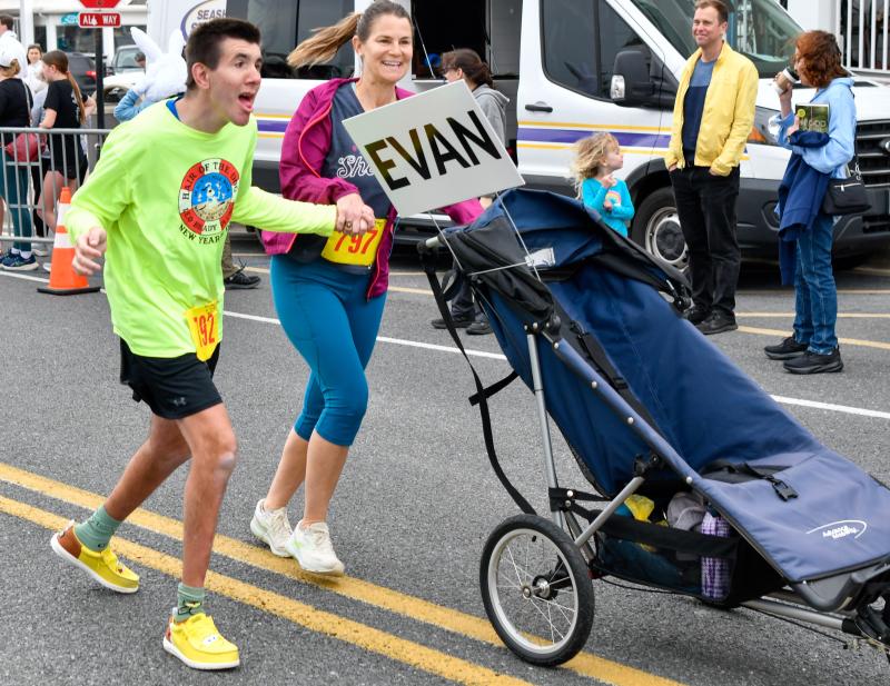 Rebecca Polun runs with her athlete Evan.