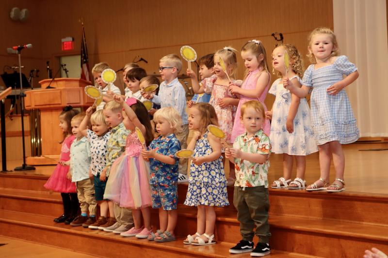 The Duckling class from Epworth United Methodist Church preschool brings sunshine to their performance on graduation day. Shown in back are (l-r) Aidan Nee, Grant Nee, Asher Thompson, Ethan Mastrian, Robert Grenert, Charlie Frasso, Hayes Hopkins, Violet Montgomery, Maddie Withers and Holly Mace. In front are Olivia Dashiell, Lucas Geyer, Liam Eisenstein, Ethan Monk, Charlotte Glace, Axel Walker, Demi Calabrese and Logan Schrock.