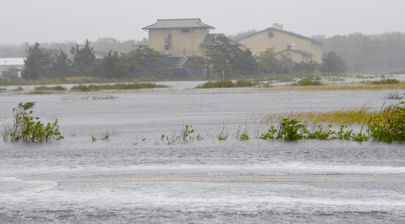Powerful winds and heavy rains from hurricanes can cause higher-than-normal tides and major flooding near the coast and inland. Savannah Road (foreground) and the marshes near the Lewes wastewater treatment plant were covered with water in 2022. RON MACARTHUR PHOTO