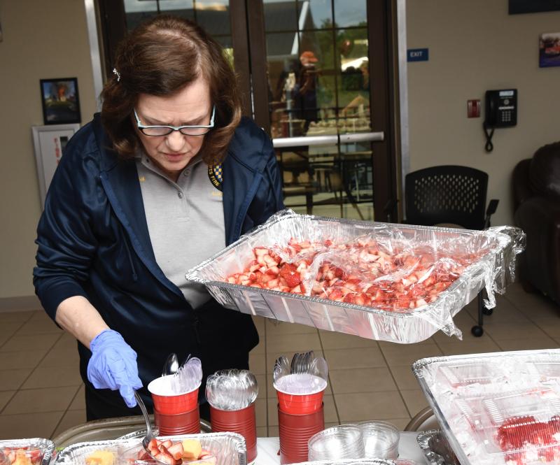 Lewes Fire Department Auxiliary member Olga Fitch is busy dishing up strawberry desserts during the 2024 Strawberry Sip & Shop at Station 2 in Nassau. RON MACARTHUR PHOTO