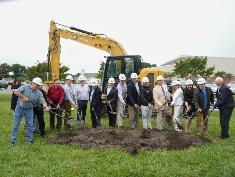 Delmarva Christian Schools’ Stronger Together project leaders, including board members, community leaders and others on the leadership team, dig into the ground at the project’s official groundbreaking ceremony May 27 at the school’s Georgetown campus. ELLEN MCINTYRE PHOTOS