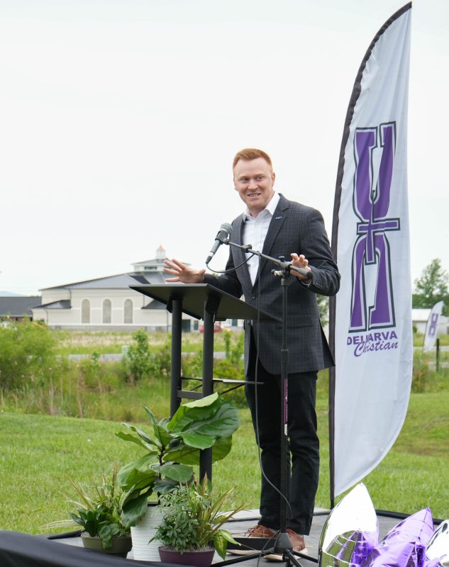 Delmarva Christian Director of Advancement Justin Savini speaks at the ceremony.
