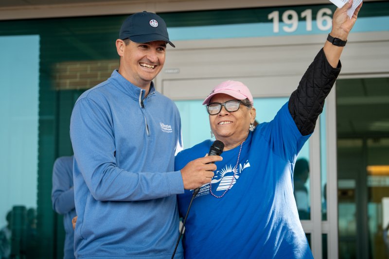 Sean Flanigan, Beebe Medical Foundation gift officer, celebrates the Miracle Mile with Betty Streett. MATTHEW CONLIN PHOTO