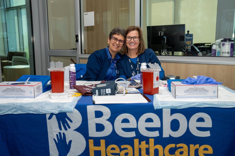 Edna Glassman-Lackow, left, and Susan Shirk are on hand to provide information during the Beebe Healthcare Miracle Mile. MATTHEW CONLIN PHOTO