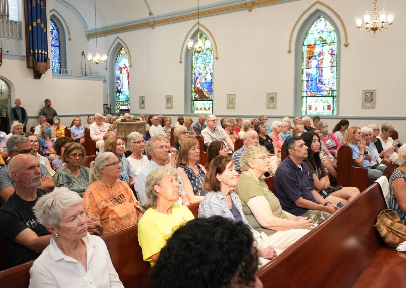 Community members fill the pews at St. Peter’s Episcopal Church in Lewes for the launch of SOAH’s statewide initiative Hate Has No Home Here.