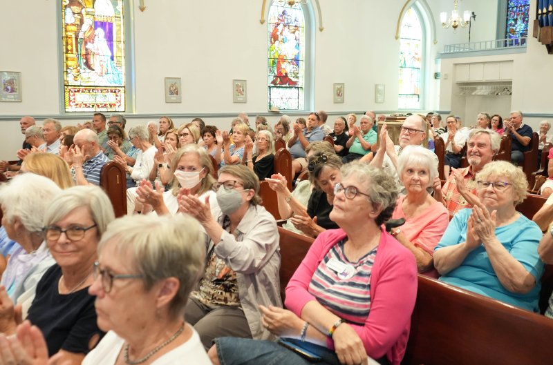 Audience members clap after a speech by U.S. Sen. Lisa Blunt Rochester.