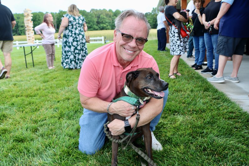 Bill Johnston and his HAP rescue, Ella, support the fundraiser.