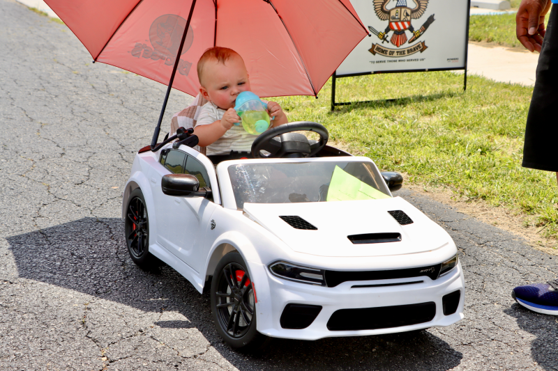 All the cool kids are driving these, like 10-month-old Kaiser Zwiebel of Seaford. His father was controlling the mini-car with a remote.