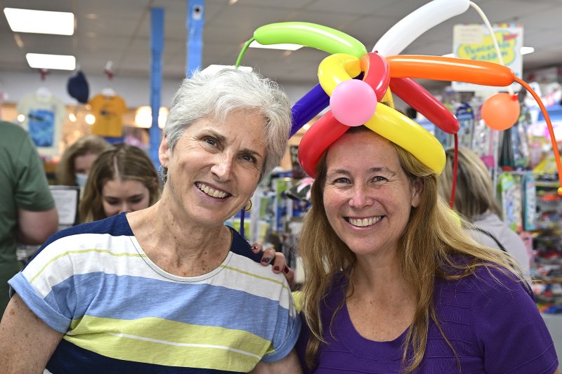 Teresa Ford, left, former owner of Kids’ Ketch, catches up with new co-owner Lori Smyth.