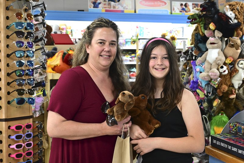 Christine, left, and Lincoln Cunane, 10, enjoy browsing in Kids Ketch.