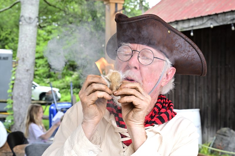 Historical interpreter Jim Martin shows how to make fire.
