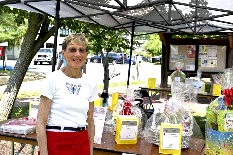 Kathy O’Grady, a seven-year cancer survivor, works the silent auction table.