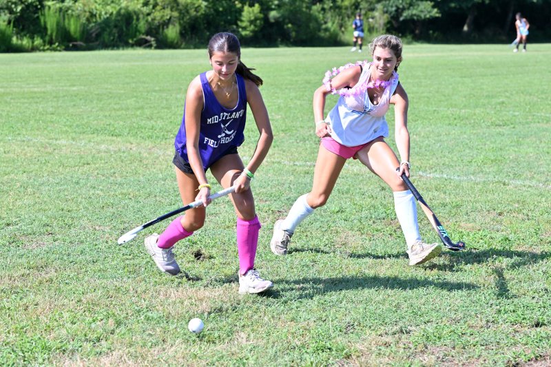 Mason Woodbridge, left, controls the ball while Aleah Kaczynski plays close defense during a scrimmage.