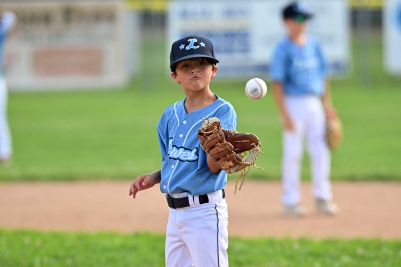 During a timeout, Lewes pitcher Conor Cleary has a catch with himself.
