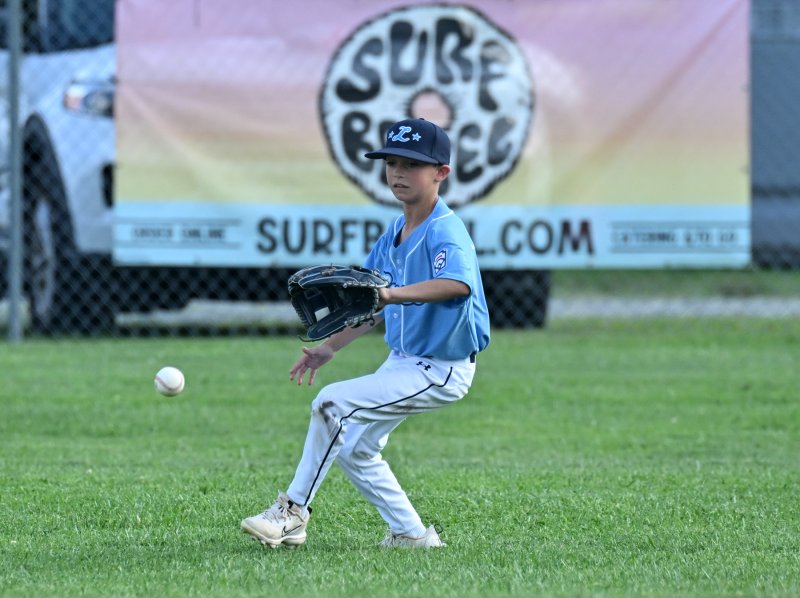 Lewes outfielder Deacon Jones runs down a Georgetown hit.