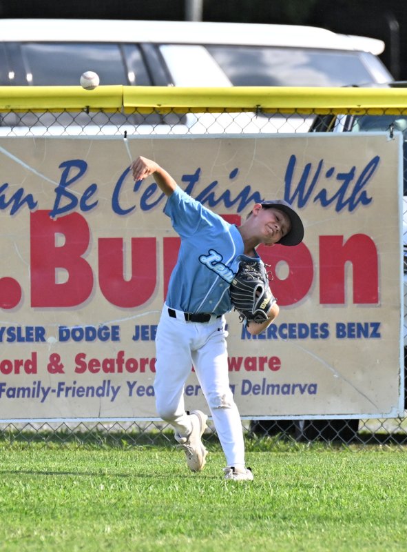 Lewes outfielder Deacon Jones launches a throw into the infield after a Georgetown hit.