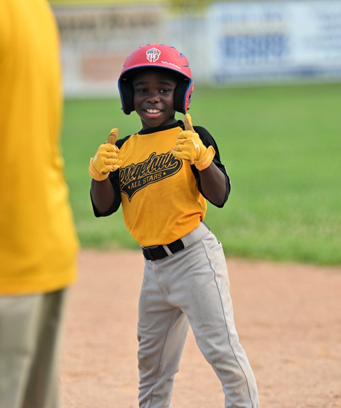 Tyaire Mackey lets the team know he hit safely for the Georgetown squad.